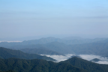 Naklejka premium Mountains with blue sky and clouds background
