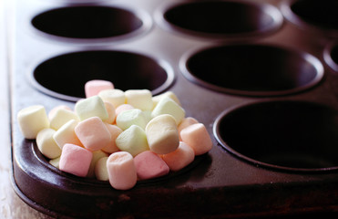 colorful marshmallows on black background