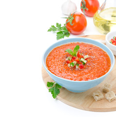 cold tomato soup gazpacho with basil and croutons in a bowl