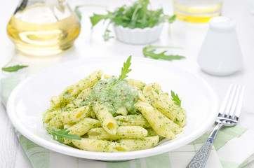 pasta penne with sauce of arugula and peas horizontal