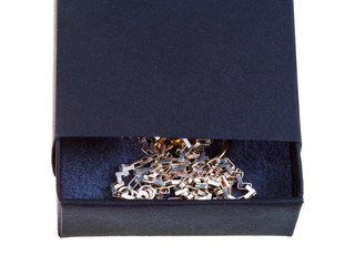 open black gift box with golden chainlet