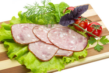 Sausages with salad and basil