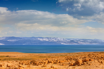 Fototapeta na wymiar Dead Sea in the desert with mountain view