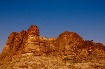 Fototapeta premium A red rock mountain in Wadi rum Jordan desert
