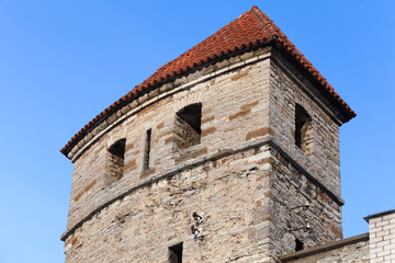 Fototapeta na wymiar Fragment of stone tower. Fortress in old Tallinn