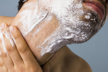 Young man shaving