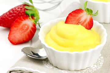 Delicious vanilla cream dessert with fresh strawberries