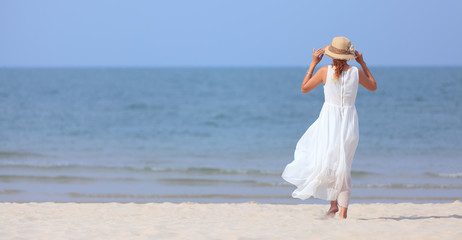 Fototapeta na wymiar Woman on beach