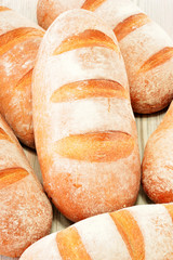 Composition with loafs of bread isolated on white background