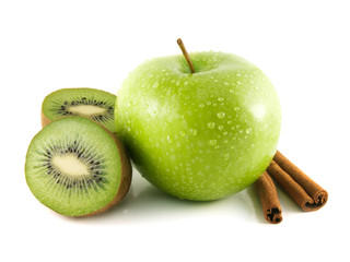 Isolated wet green apple with kiwi and cinnamon