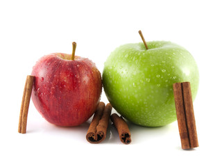Isolated wet green and red apples with cinnamon