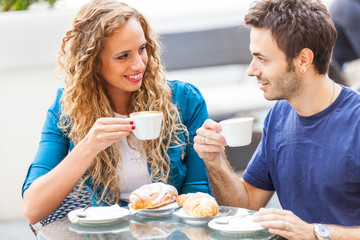 Young Couple Having a Traditional Italian Breakfast