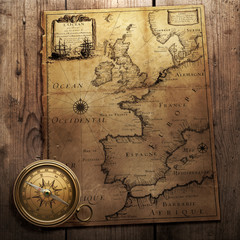 old compass on vintage map 1666