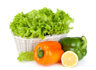 Colorful bell peppers with lemon and lettuce