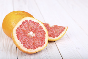 Fototapeta na wymiar grapefruit on a wooden background. selective focus