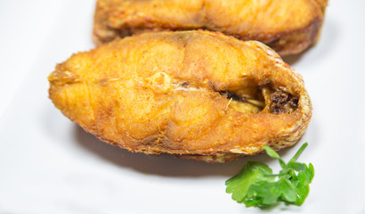 Portions of deep fried red snapper fish.