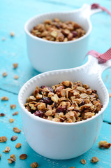 Homemade granola on wooden turquoise background
