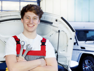 Car mechanic is satisfied with his job