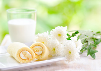 Glass of milk and fresh cake