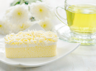 Cup of herbal tea and fresh cake