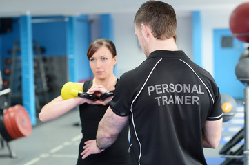 Fitness instructor with girl doing workout
