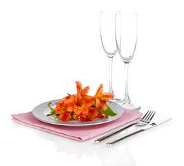 Festive table setting with flowers isolated on white