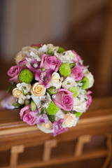 Beautiful wedding bouquet of fresh pink roses bridal flowers