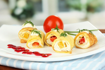 Egg rolls with cheese cream and paprika,on plate,