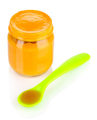Baby food with weaning spoon isolated on white