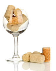 Wineglass and corks isolated on white