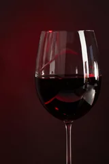 Fotobehang Wine in glass on dark background © Africa Studio