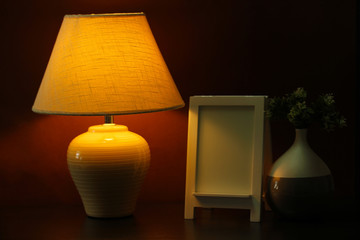 White photo frame and lamp