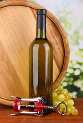 Composition of corkscrew and bottle of wine, grape, wooden