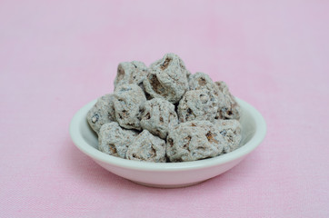 Dried salted Chinese plum isolated on white background