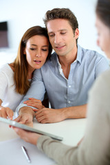 Young couple meeting financial adviser