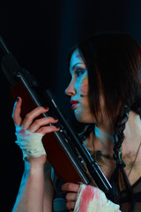 Beautiful woman holding weapon