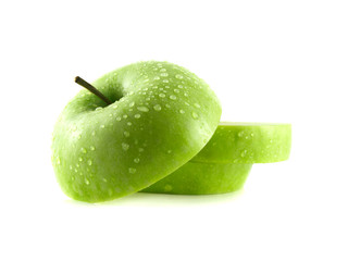 Isolated green apple slices with water drops