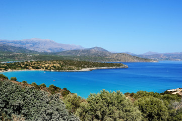Fototapeta na wymiar Calm harbor with blue water, Crete, Greece