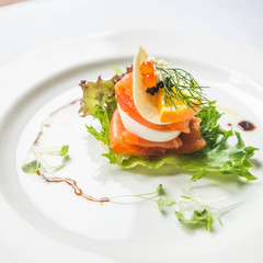Canapes with salmon and red caviar