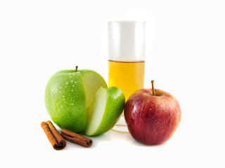 Isolated red, green apple with cinnamon, glass