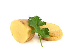 Potato sliced half and green parsley isolated