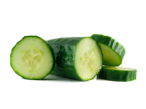Sliced cucumber with slices isolated on white