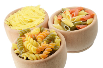 Wooden bowls of tricolor pasta