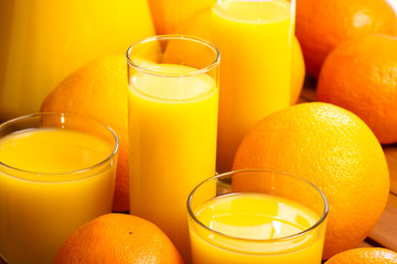 Glasses of  juice  and oranges