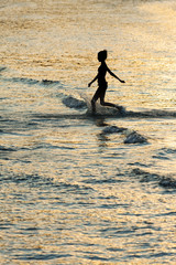 Girl silhouette in the sea