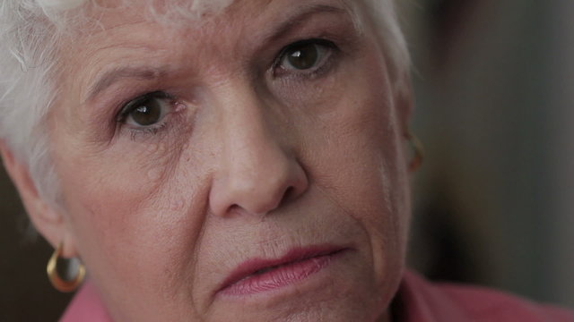 Close up shot of senior woman's face, unhappy