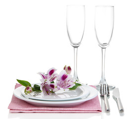 Festive table setting with flowers isolated on white