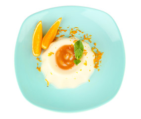 Panna Cotta with orange zest and caramel sauce, isolated