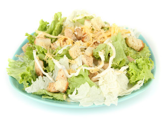 Caesar salad on blue plate, isolated on white