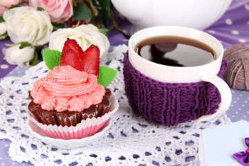 Delicious beautiful  cupcake on dining table close-up
